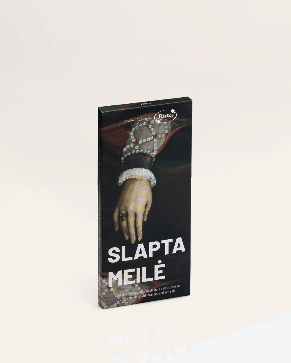 Closed “Slapta meilė” dark chocolate packaging with an image of Queen Barbara's hand