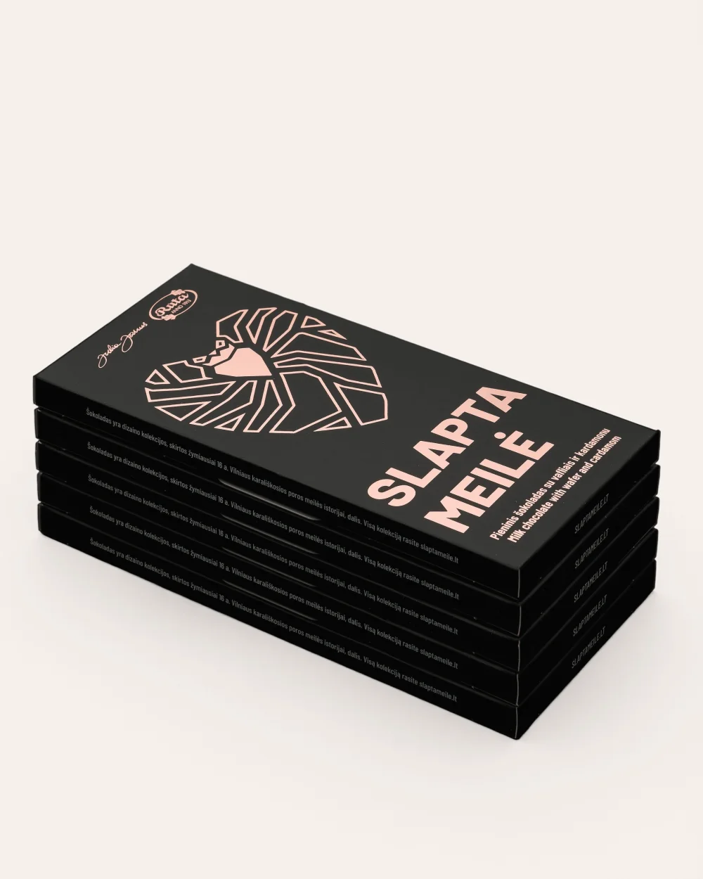 A pile of “Slapta meilė” milk chocolate packs with wafers and cardamom on a light background