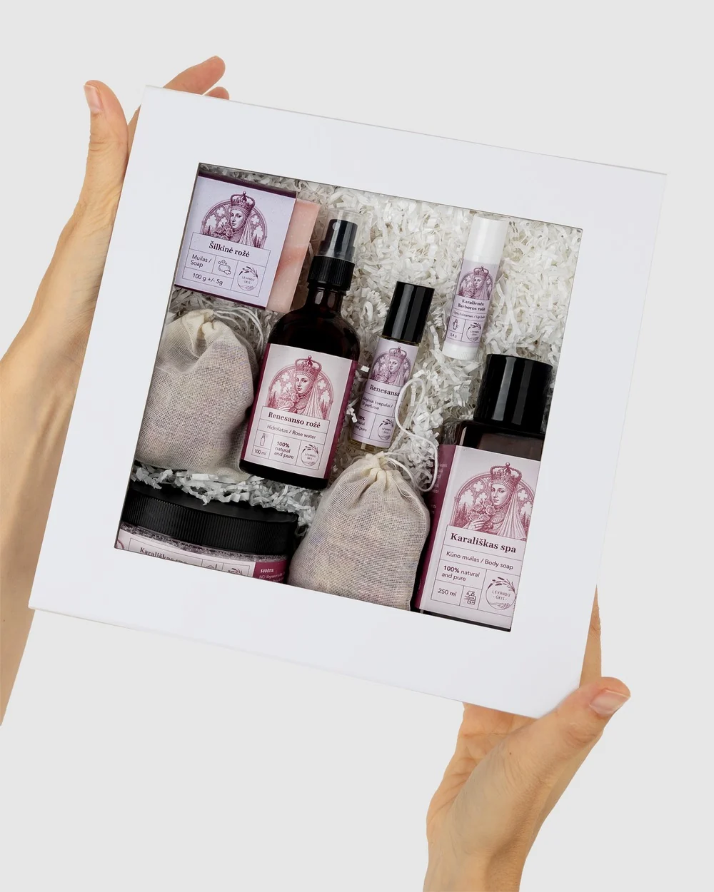 “Renaissance Rose” rose SPA gift set in a white box with a window, held in hands