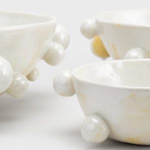 Close-up detail of the beads and glaze of pearl white “The Queen's Pearl Bowl” bowls