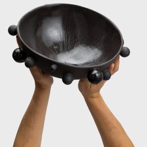 Large matte black “The Queen's Pearl Bowl” raised in two hands, inside visible