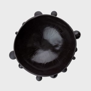 Large matte black “The Queen's Pearl Bowl” from above, glossy inside visible