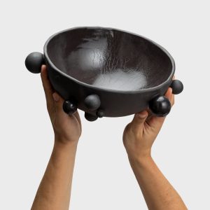 Matte black “The Queen's Pearl Bowl” with little balls, raised in two hands