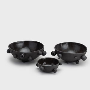 Three matte black “The Queen's Pearl Bowl” bowls in different sizes, angled view from above