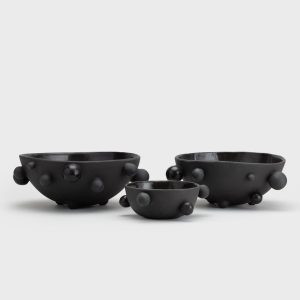 Three matte black “The Queen's Pearl Bowl” bowls in different sizes side by side, side view