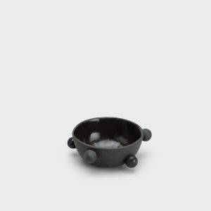 Small matte black “The Queen's Pearl Bowl” with balls on a light background