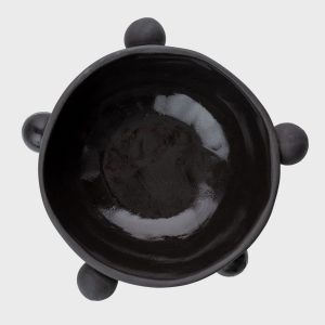 Small matte black “The Queen's Pearl Bowl” from above with four balls
