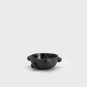 Small matte black “The Queen's Pearl Bowl” from the side, seen from a distance