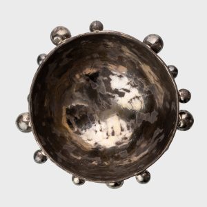 Large dark gold “The Queen's Pearl Bowl” from above with little balls around the rim