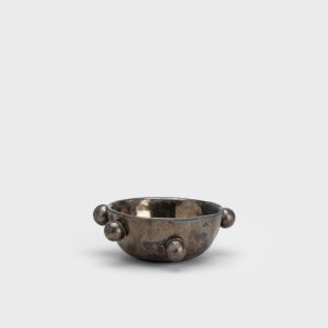 Small dark gold “The Queen's Pearl Bowl” from the side, seen from a distance