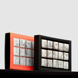 Orange box and an open black box of decorated “Royal Vilnius” gingerbread