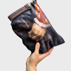 “Augustus” cosmetic bag with an image of Sigismund Augustus's painted hand, held up against a light background