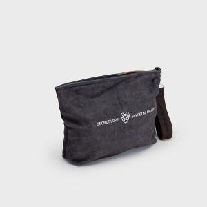 Back of a dark grey “Augustus” cosmetic bag with the words “Secret Love” and a heart logo