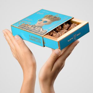 Open box of “Queen Catherine Jagiellon” chocolate sweets in hands