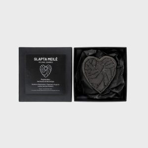 “Crowned Heart Within a Heart” magnet in an open black box next to the lid