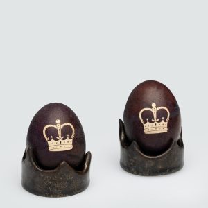 Dark gold “Vilnius Crown” holders with dark eggs decorated with a crown drawing