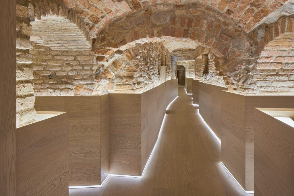 Lit path between brick vaults in a spa centre – “Queen Barbara's Pearls” treatment