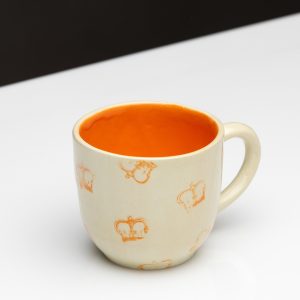 “Very Royal” ceramic mug with an orange inside and orange crowns