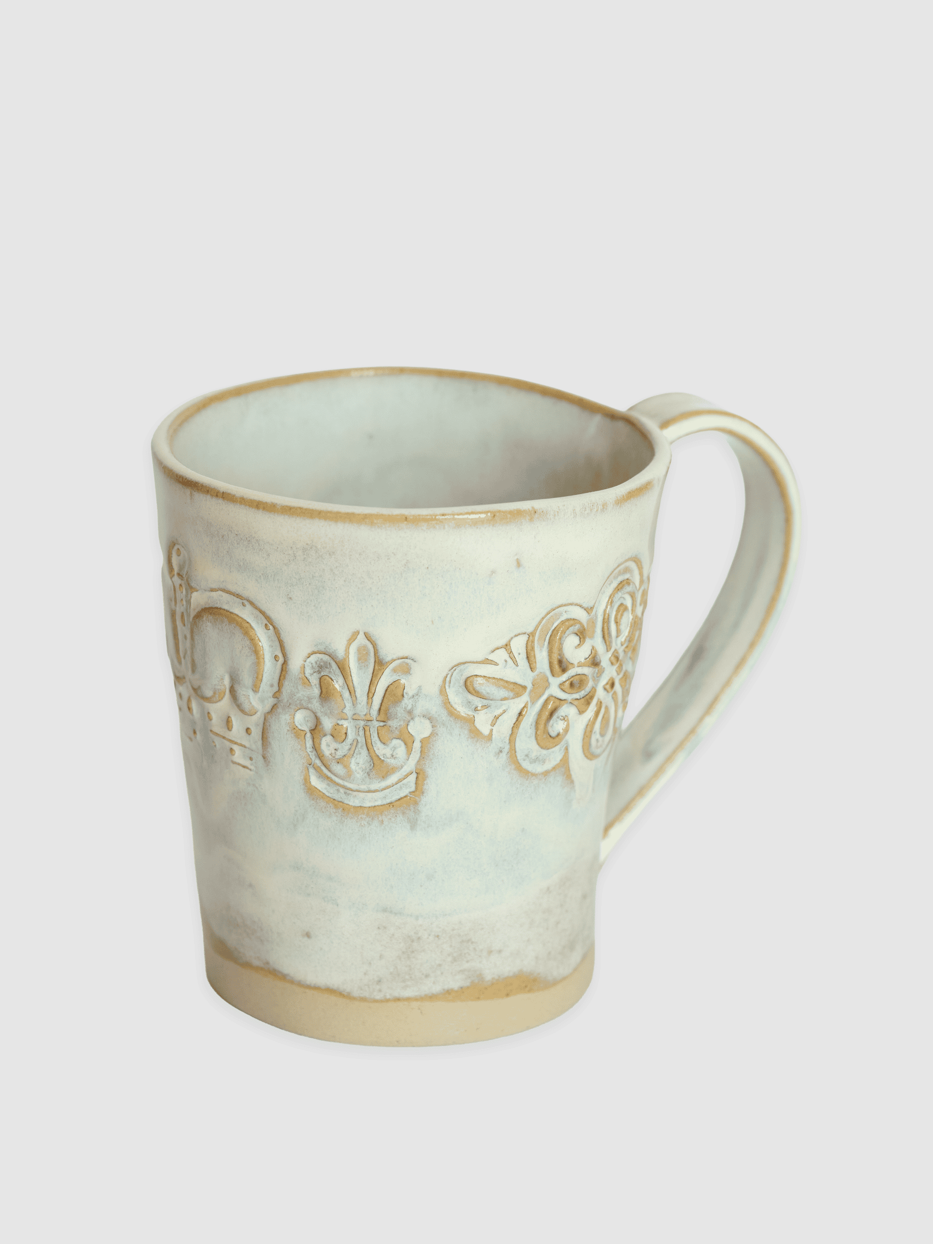 White ceramic mug “Audience” with a handle and a raised ornament on a light background
