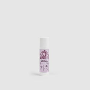 One “Queen Barbara's Rose” lip balm with a purple label on a light background