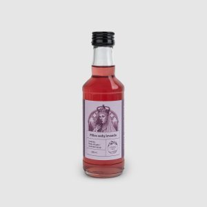 One bottle of red “Castle Gardens Lavender” lavender flower syrup on a light background