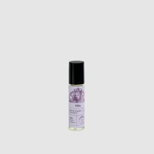 Bottle of “The Castle” oil perfume with a roll-on applicator and black cap on a light background