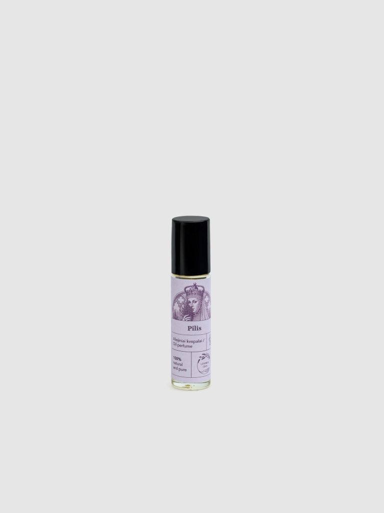 Bottle of “The Castle” oil perfume with a roll-on applicator and black cap on a light background