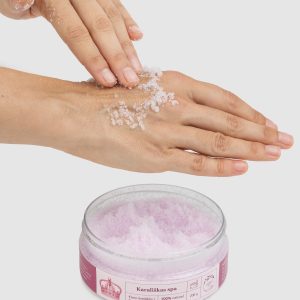 “Royal SPA” rose body scrub being applied to an arm, an open jar beside it