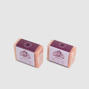 Two small pink 50 g pieces of “Silky Rose” soap bar, angled view