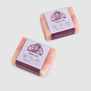 Two pink pieces of “Silky Rose” soap bar with labels, angled top view