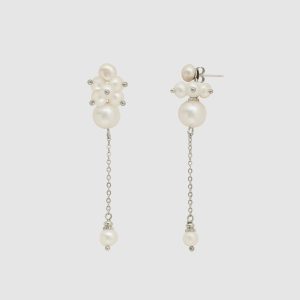 Earrings “The Queen's Garden” with a cluster of pearls and a long chain on a light background