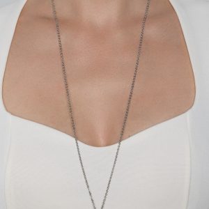 “The Queen's Garden” pendant on a long silver chain on a model's neck