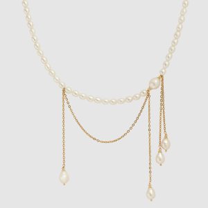 “In the Queen's Name” necklace – a pearl strand with gold chains and pearl drops
