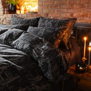 Anthracite satin pillowcases “Royal Vilnius Love Story” on a bed by candles