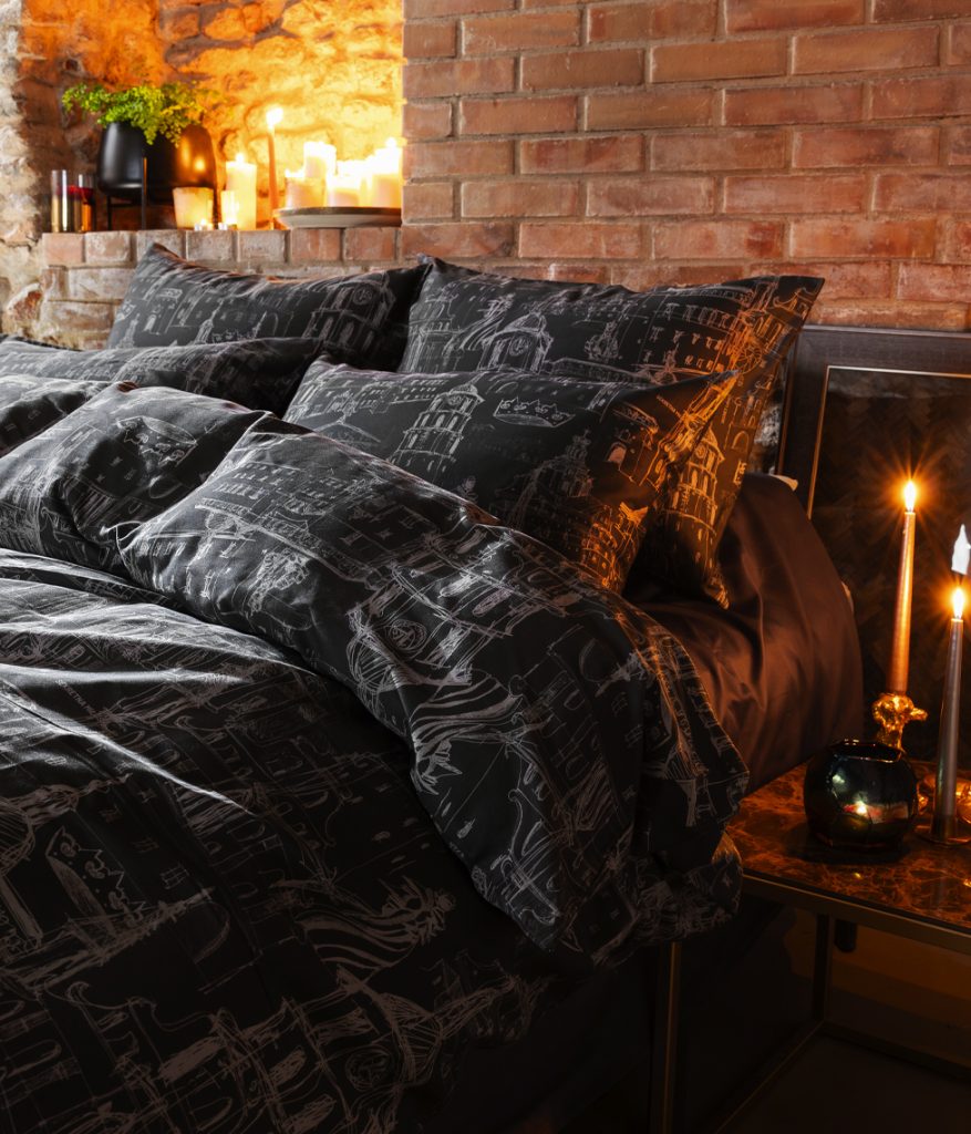 Anthracite satin pillowcases “Royal Vilnius Love Story” on a bed by candles