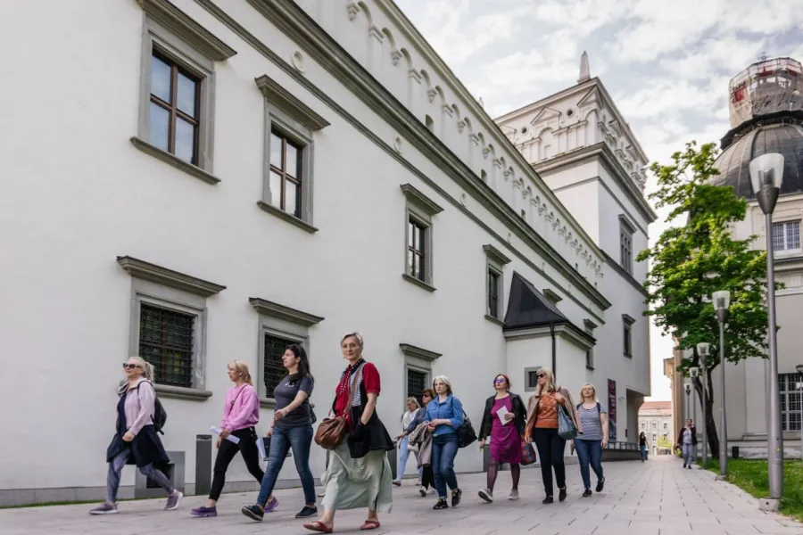 Tour group walking past the Palace of the Grand Dukes of Lithuania in Vilnius – “Royal Vilnius Love Stories”