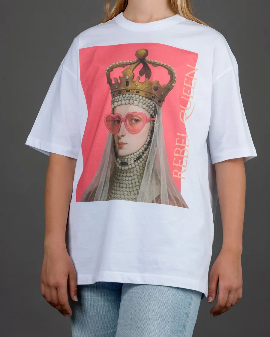 Woman in a white “REBEL QUEEN” T-shirt and light jeans, full torso view