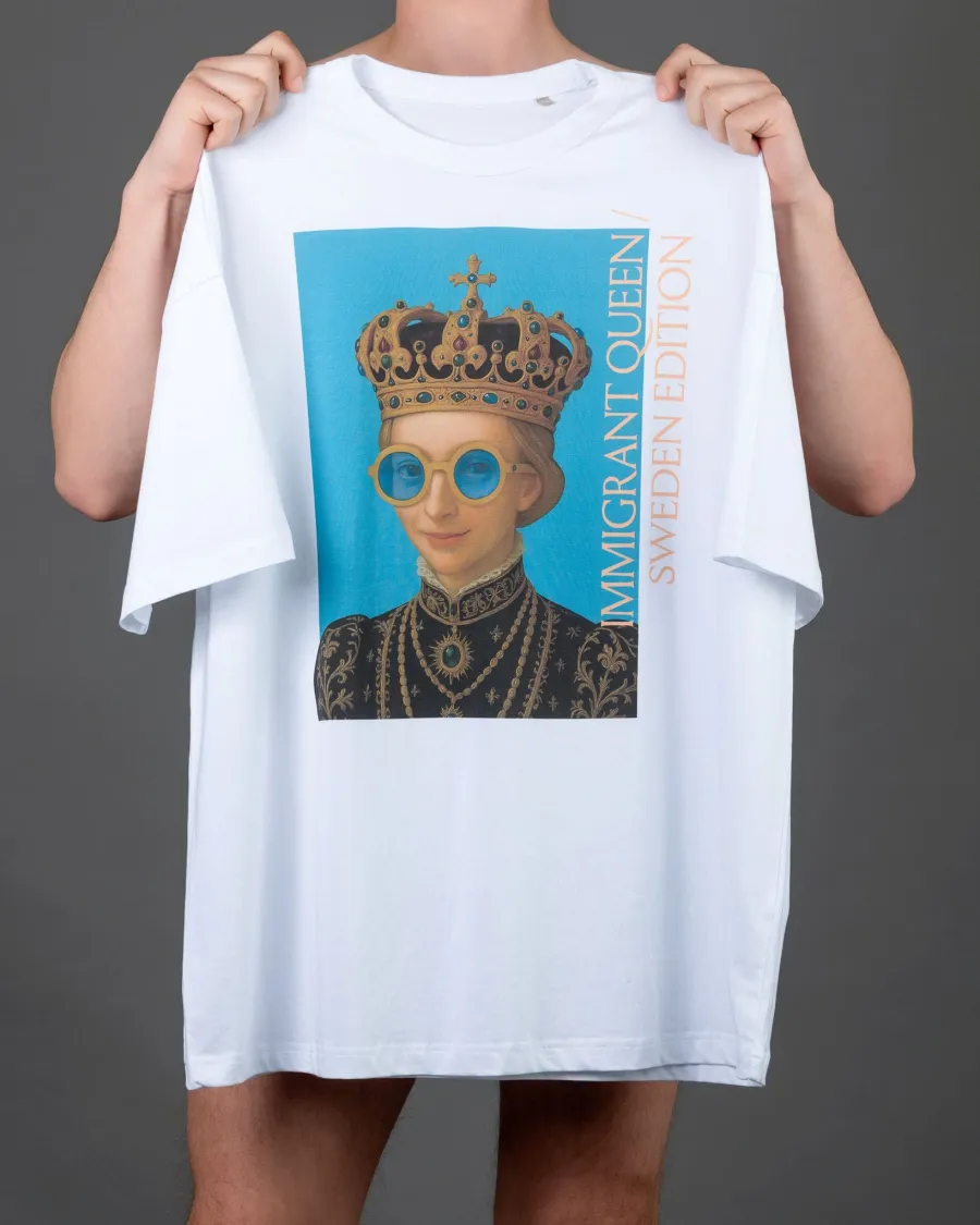 Hands holding up a white “IMIGRANT QUEEN / SWEDEN EDITION” T-shirt with a portrait of a queen