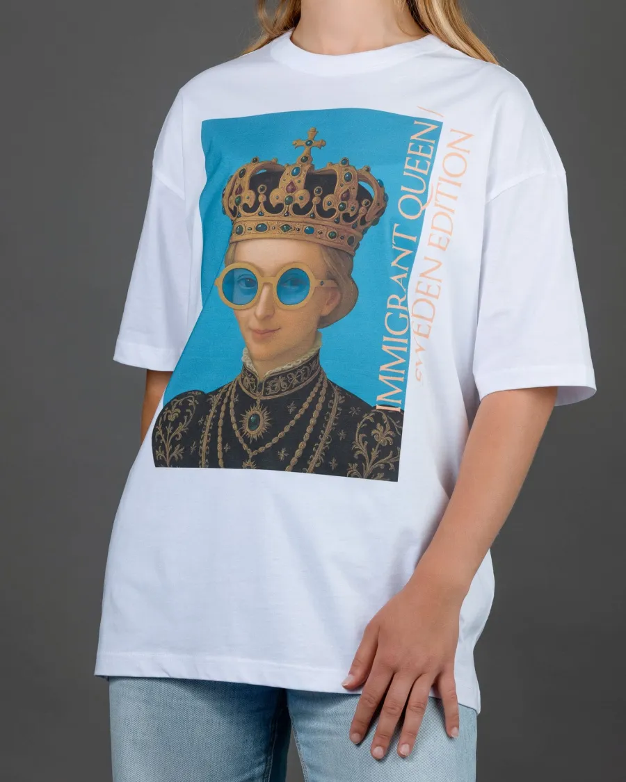 Woman in a white “IMIGRANT QUEEN / SWEDEN EDITION” T-shirt, arms down