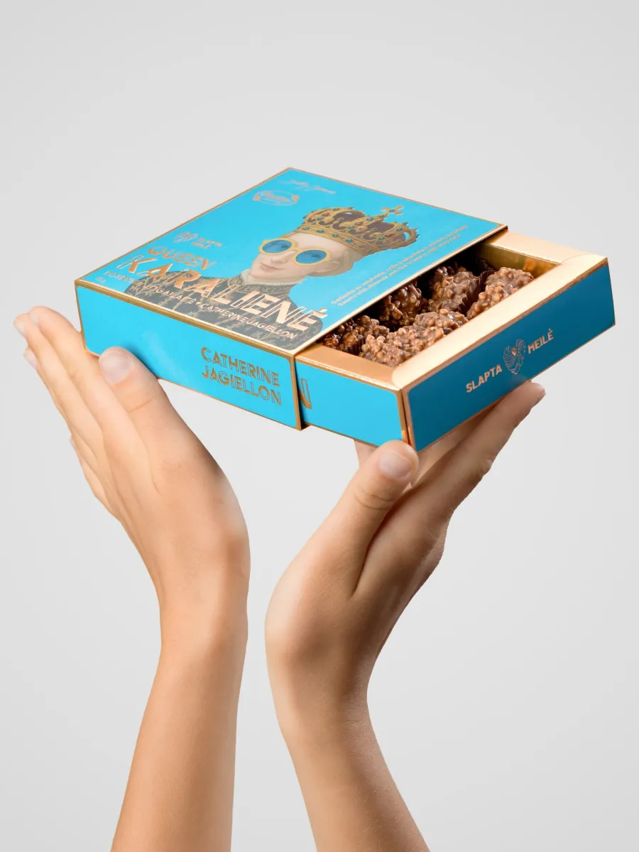 Open box of “Queen Catherine Jagiellon” chocolate sweets in hands