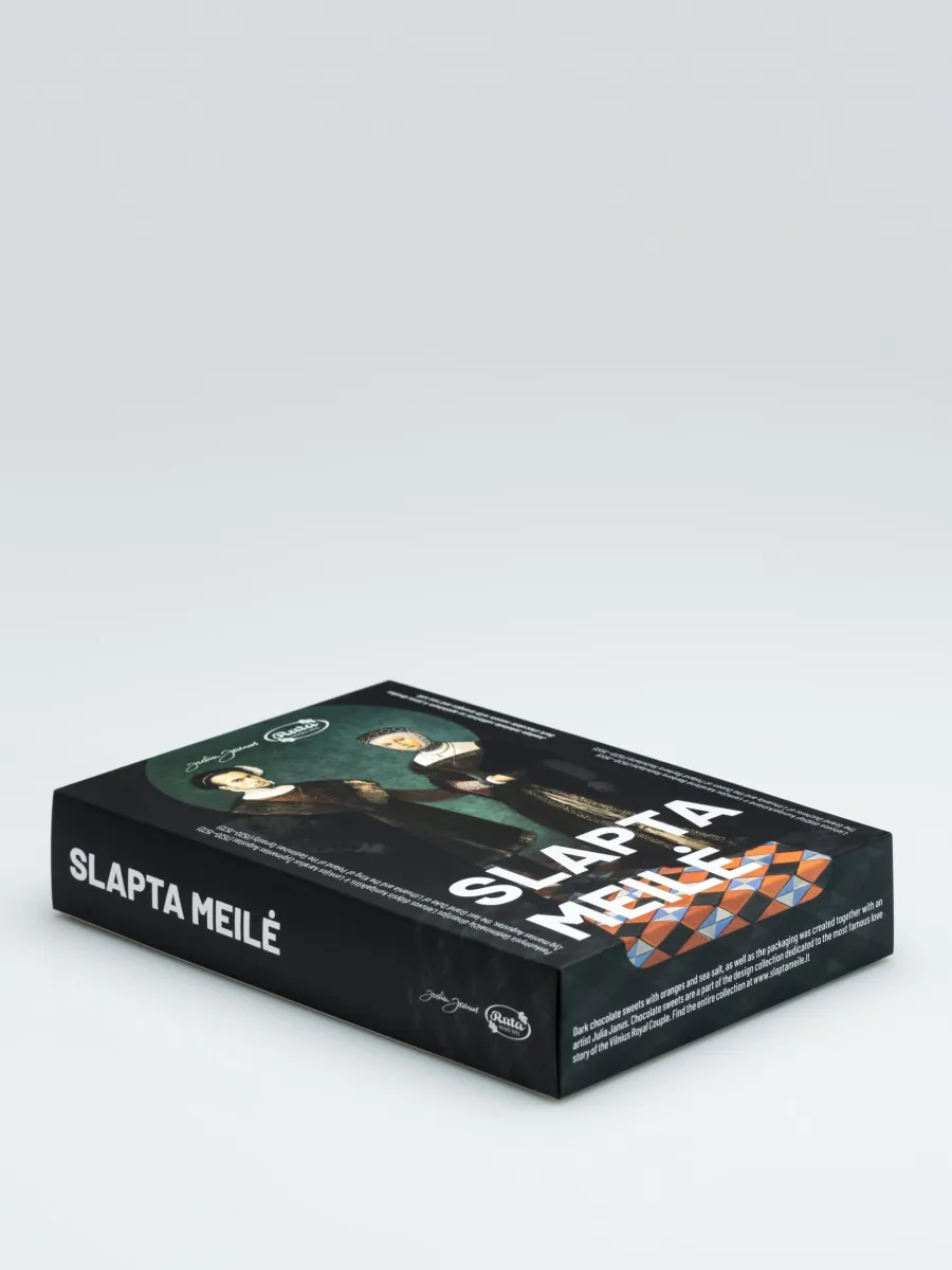 Box of “Slapta meilė” dark chocolate sweets lying down, angled view