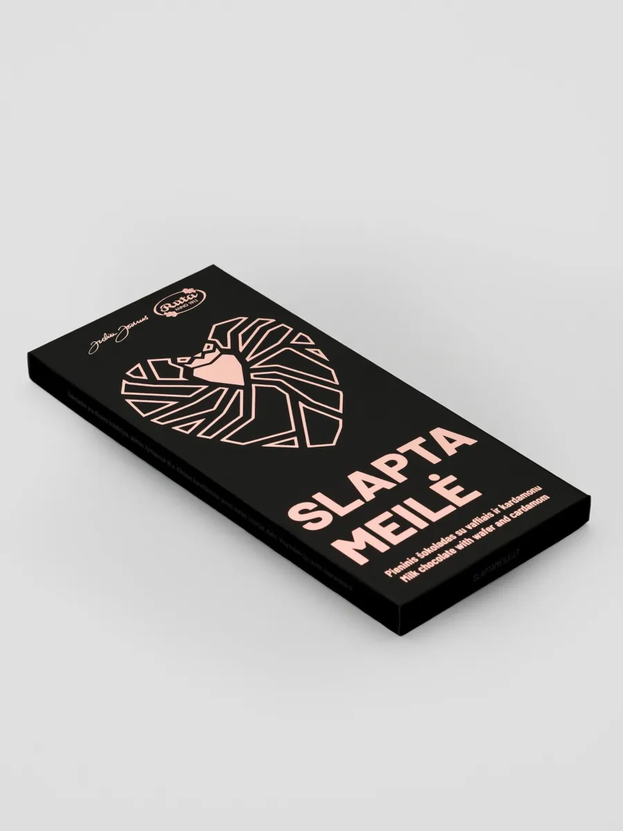 Black packaging of “Slapta meilė” milk chocolate with wafers and cardamom with a heart drawing, side view