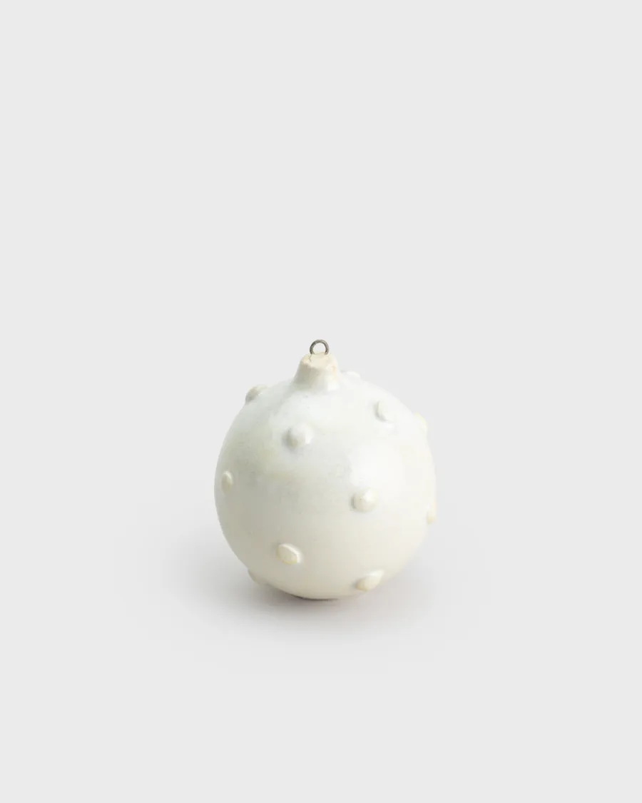 White pearl-coloured Christmas ornament “Royal Pearl” on a light background