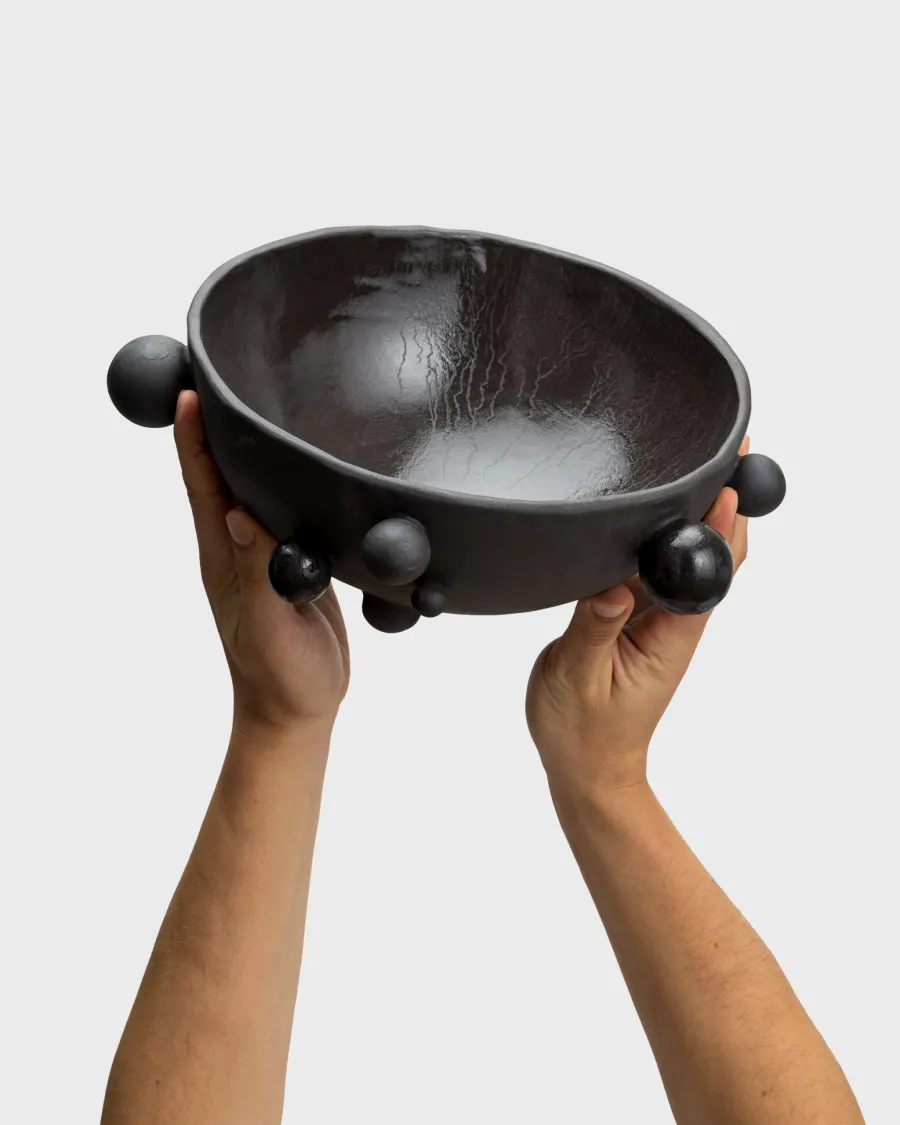 Matte black “The Queen's Pearl Bowl” with little balls, raised in two hands