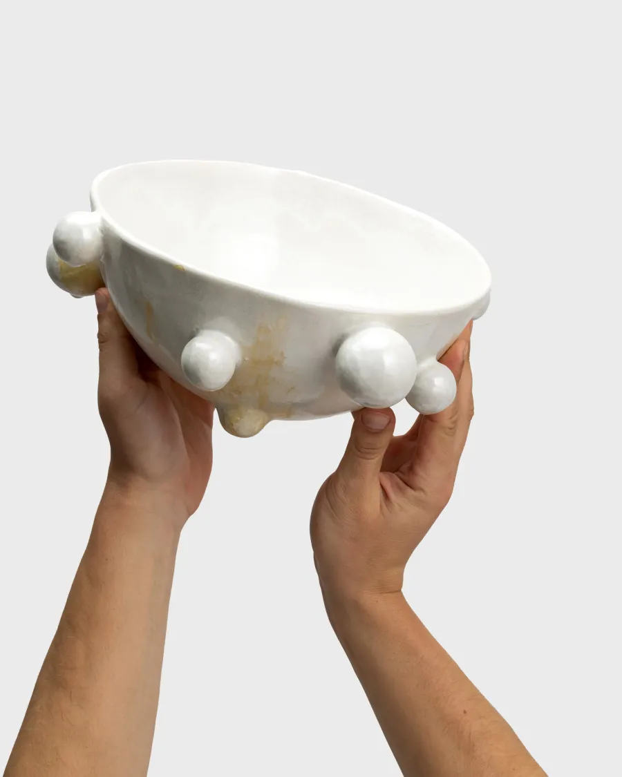 Pearl white “The Queen's Pearl Bowl” with beads, raised in both hands