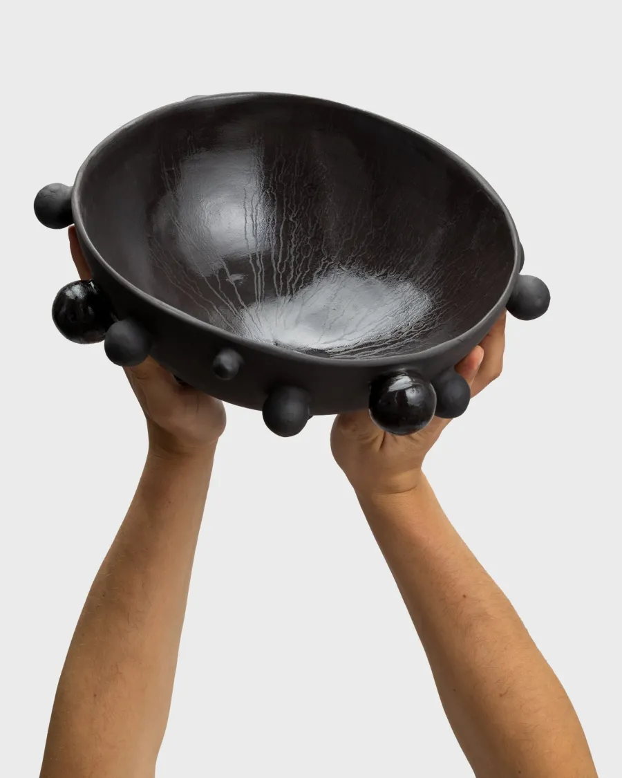 Large matte black “The Queen's Pearl Bowl” raised in two hands, inside visible