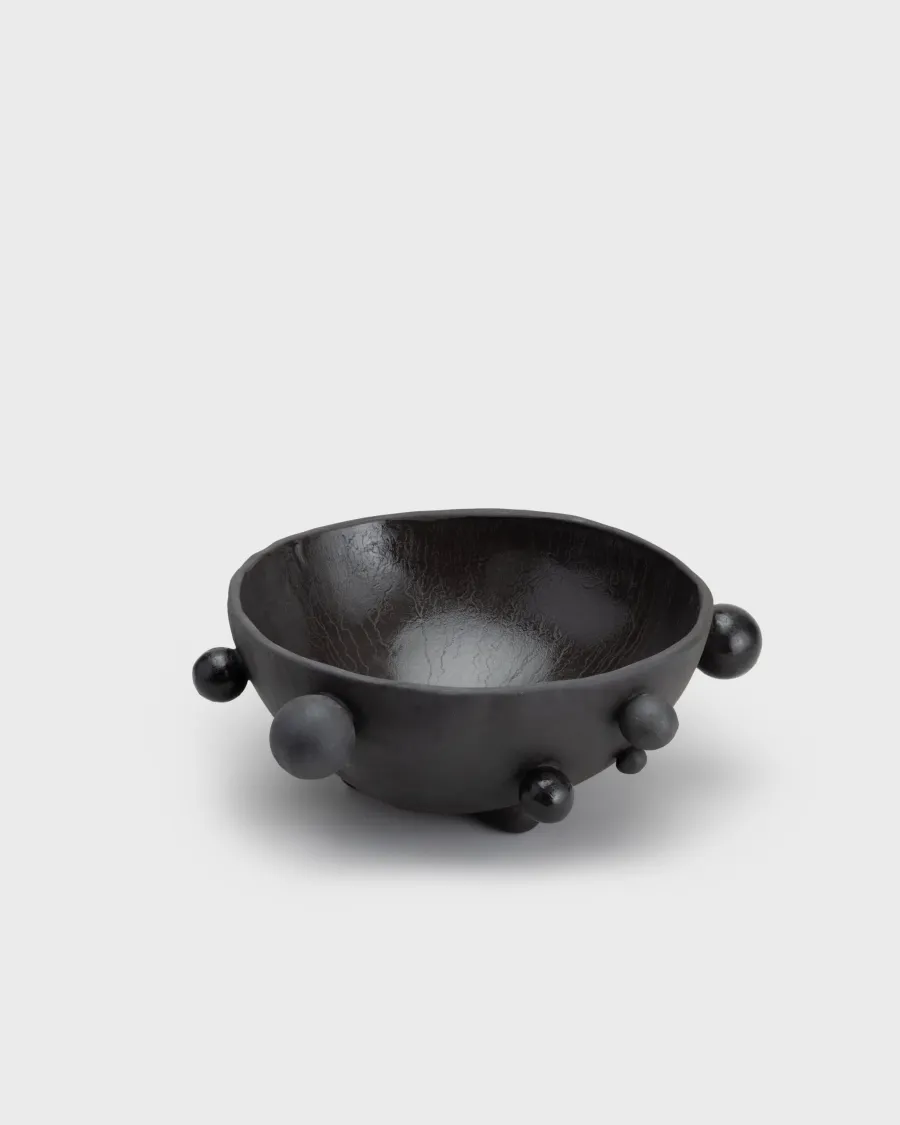 Medium matte black “The Queen's Pearl Bowl” with beads on a light background