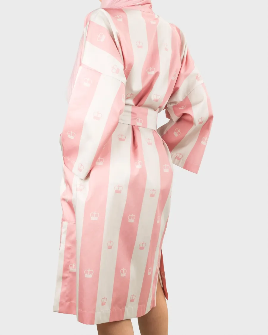 Pink striped “Your Majesty” kimono robe on a model, back turned to the side