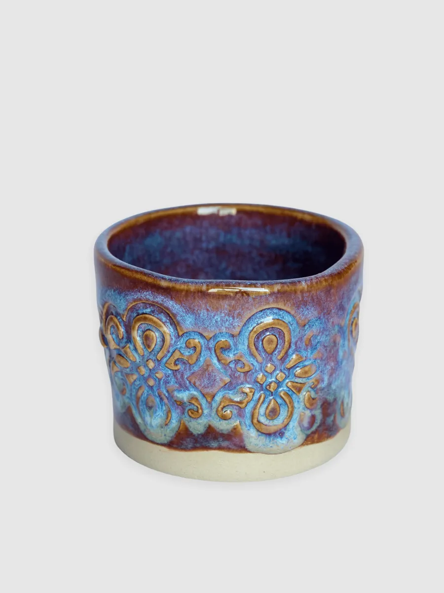Purple-glazed “Throne” espresso cup, side with a relief ornament