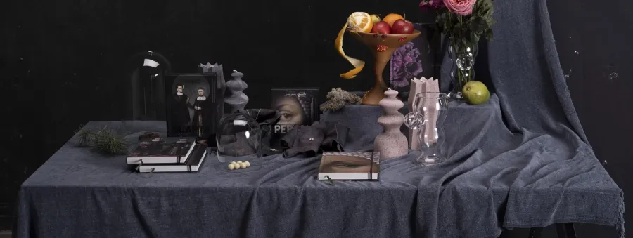 “Classic” collection banner: a dark-laid table with candles, flowers and notebooks